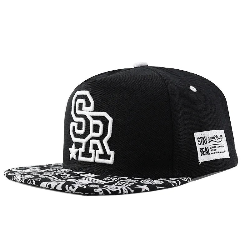 Adjustable black cotton baseball cap with embroidered lettering on the front, showing dome crown shape.
