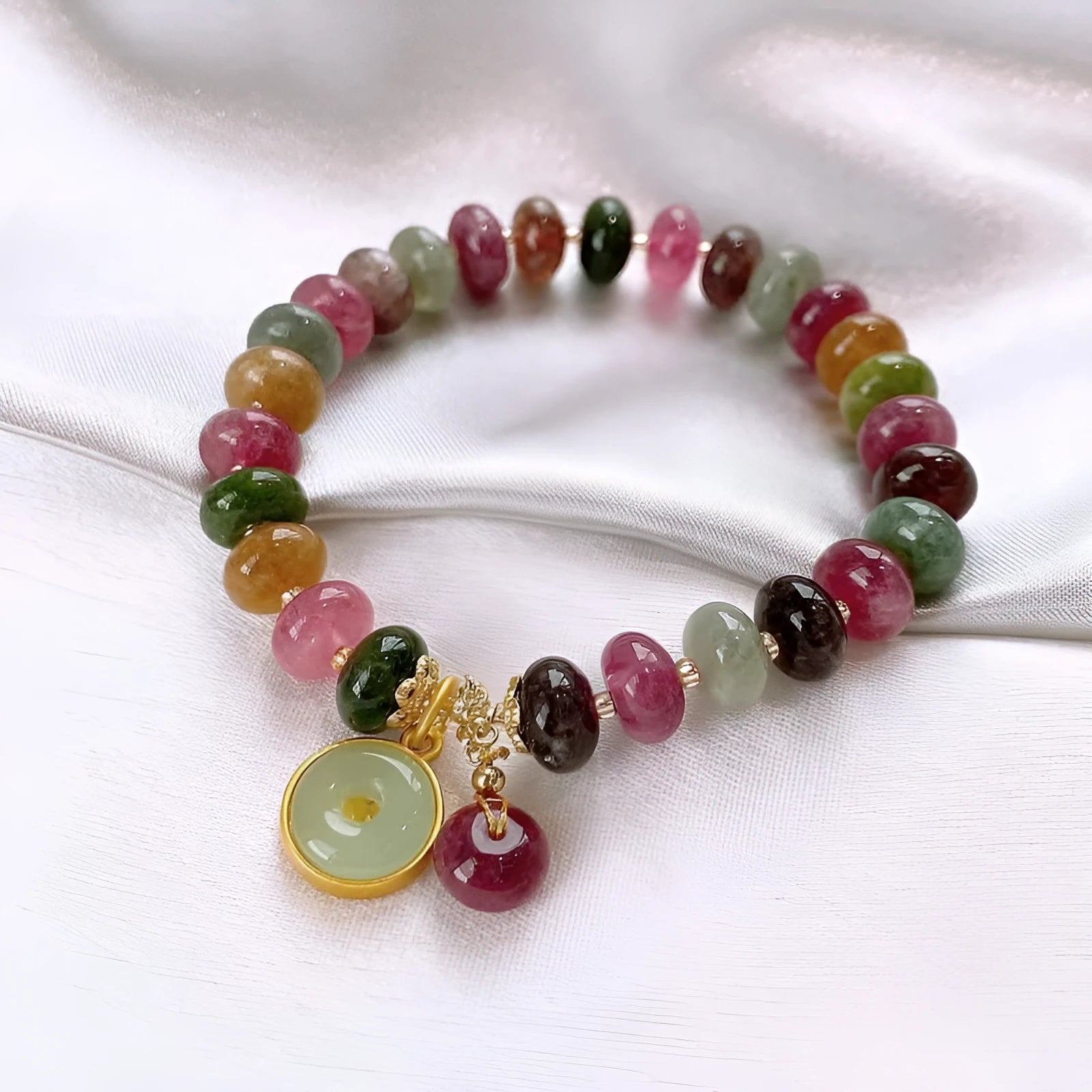Natural stone abacus bead bracelet with a colourful tourmaline rabbit pendant.