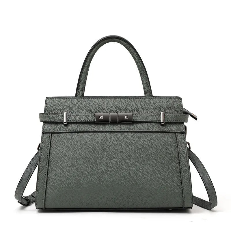 Genuine leather women's crossbody bag in clamshell design with multiple internal pockets