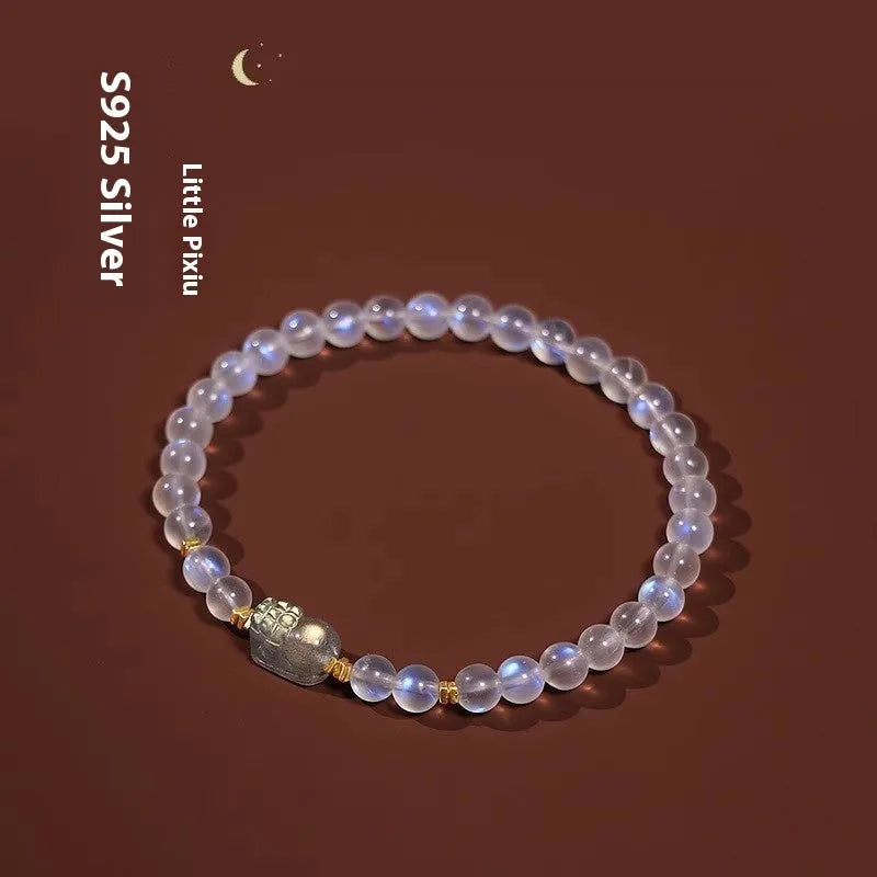 Polished moonstone bracelet with animal/Zodiac design on an adjustable cord for women.
