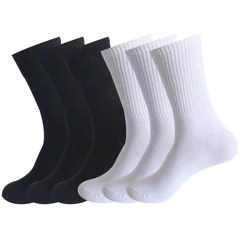 Mid-calf length sports socks in black, white, and grey colours