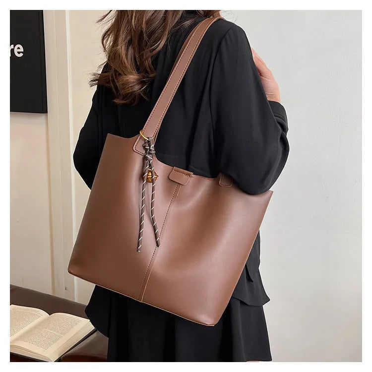 Fashionable PU leather commuter shoulder bag in brown with pendant, horizontal square shape, synthetic leather lining