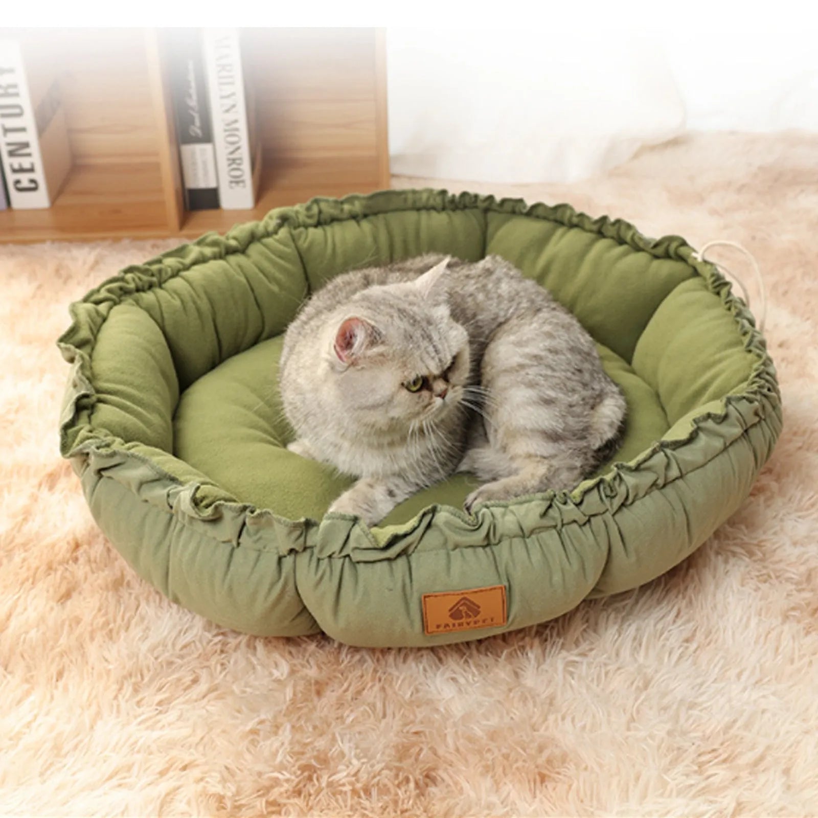 Grey reversible donut-shaped pet bed with a raised rim for a cat or small dog.