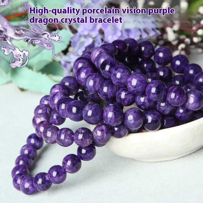 Purple charoite gemstone beaded bracelet with a platinum clasp.