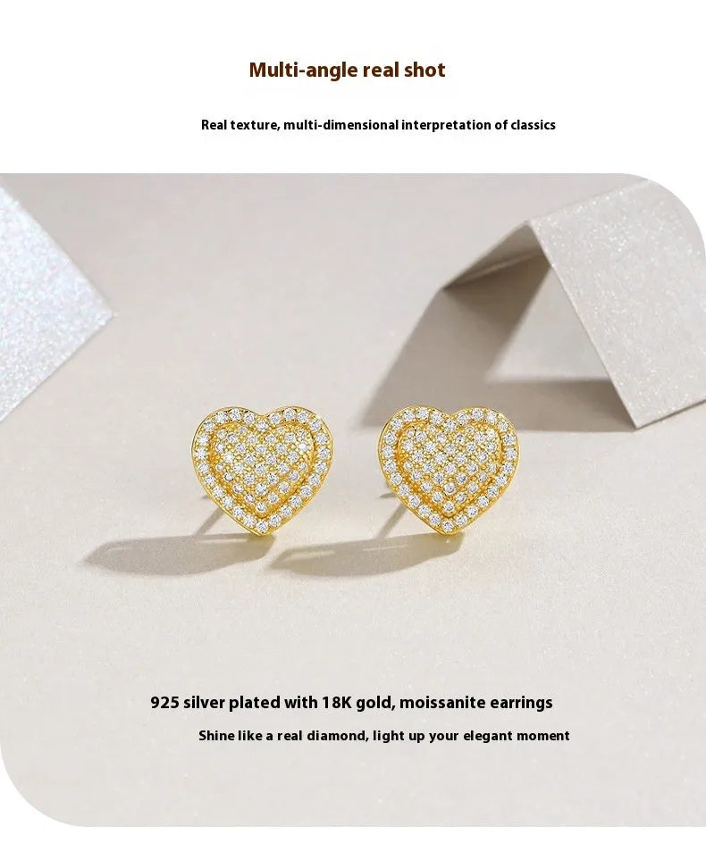 Gold and silver heart-shaped moissanite stud earrings with butterfly clutch fastenings