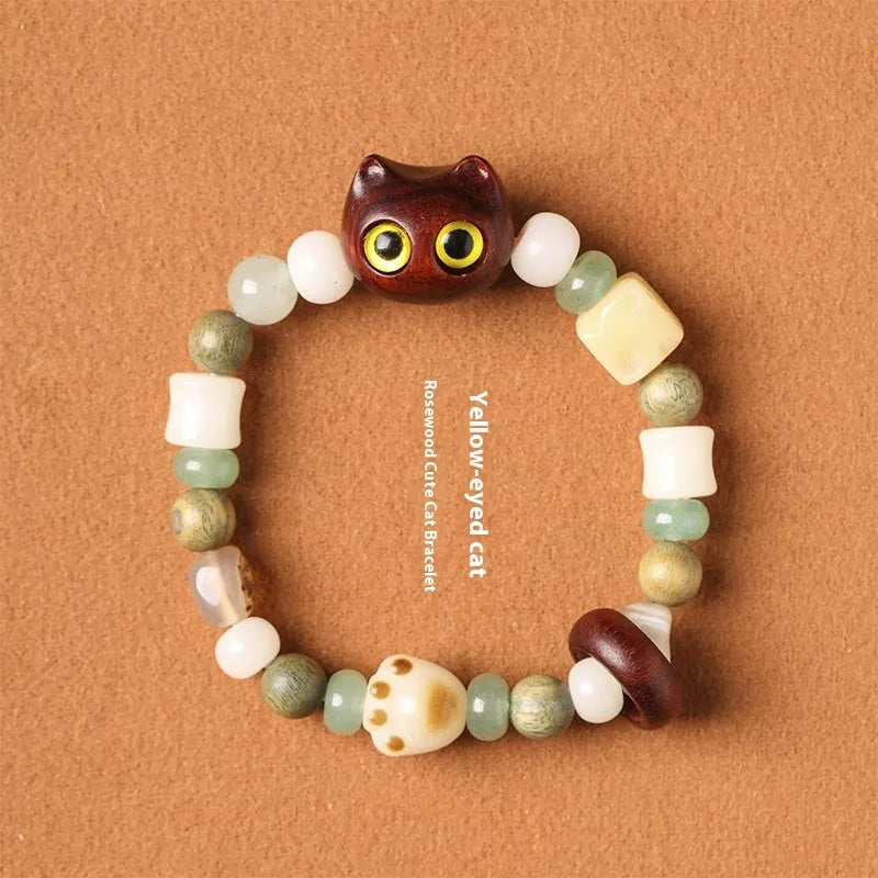 Hand-woven beaded bracelet with a cat's paw charm, jade, and wood beads in a cartoon style.