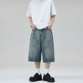 Men's loose-fit straight-leg denim shorts in a cropped length.