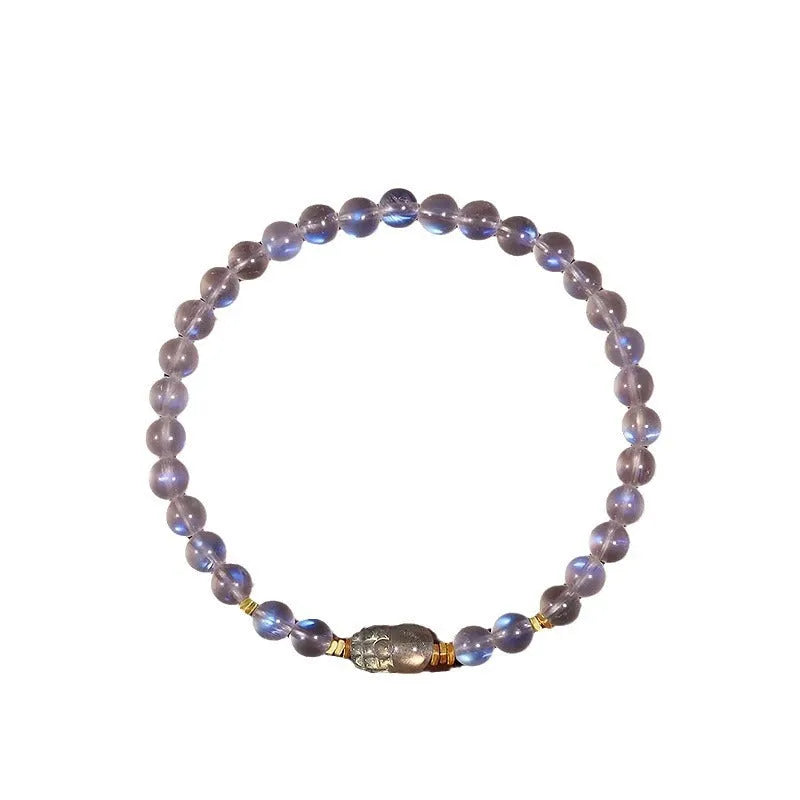 Polished moonstone bracelet with animal/Zodiac design on an adjustable cord for women.