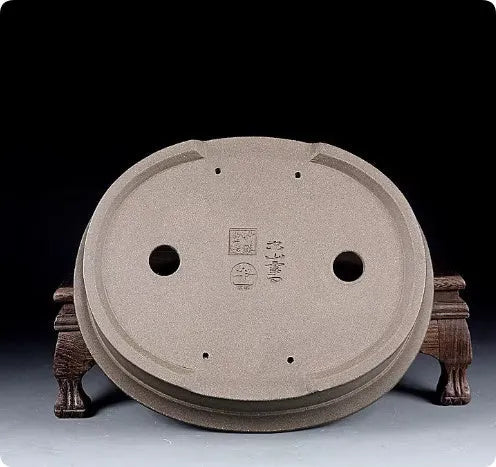 Handmade antique oval bonsai flower pot in purple sand clay, showing its 25cm length and 6.3cm depth.