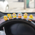 PVC cartoon duckling car decoration set with six ducks and one sign on a car dashboard