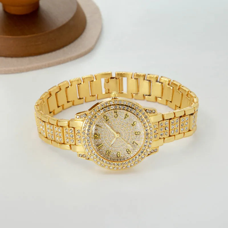 Women's starry rhinestone quartz analogue watch with gold Roman numeral dial and alloy bracelet