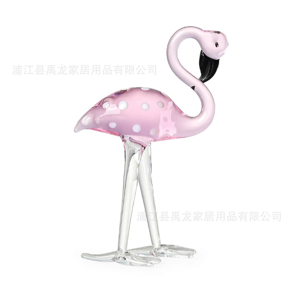 Pink crystal flamingo decorative figure on a table in modern style.