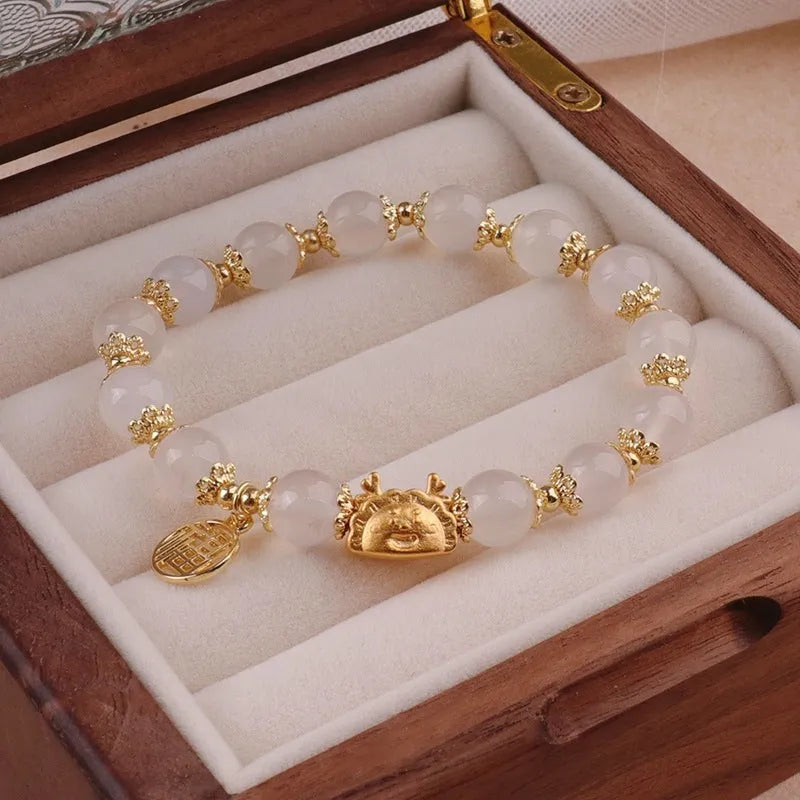 Women's floral glazed bracelet with zodiac animal charm in red, pink or white bead colours