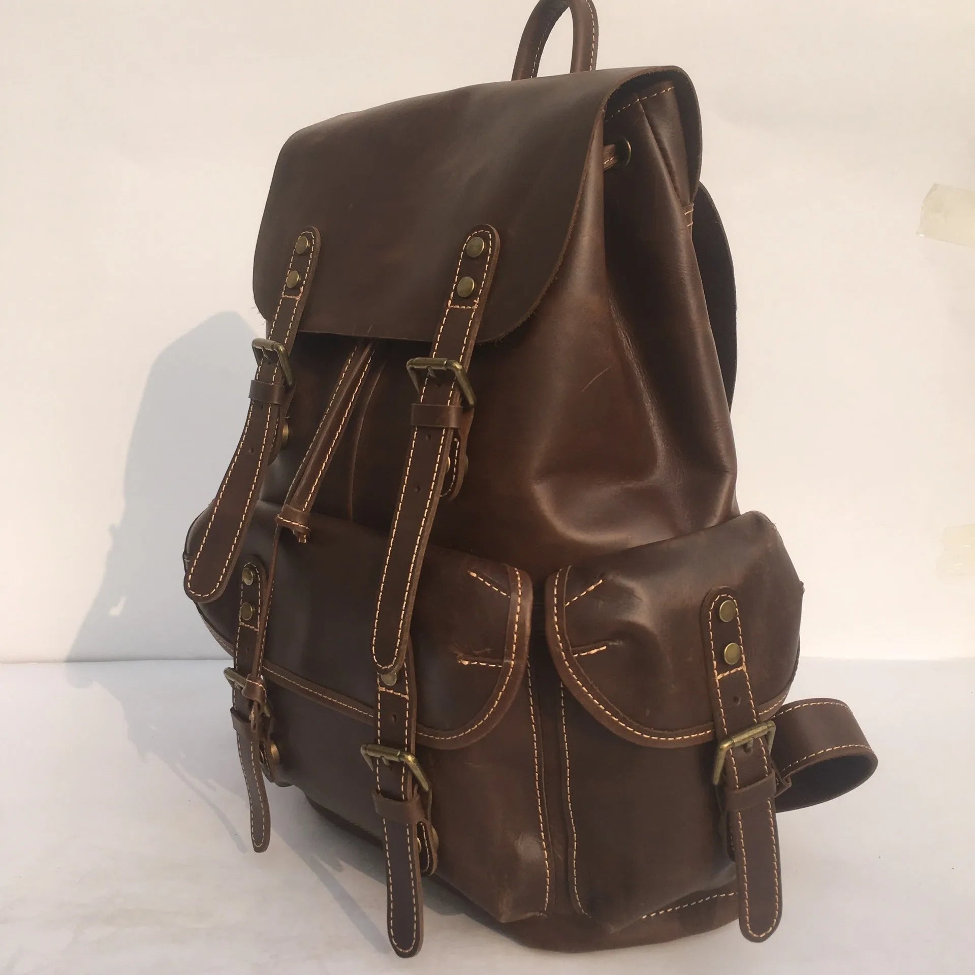 Brown men's genuine leather backpack with air pillow belt system and first layer cowhide construction