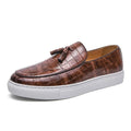 Plus size men's black tassel sneakers with round toe and oversleeve design on a rubber sole.
