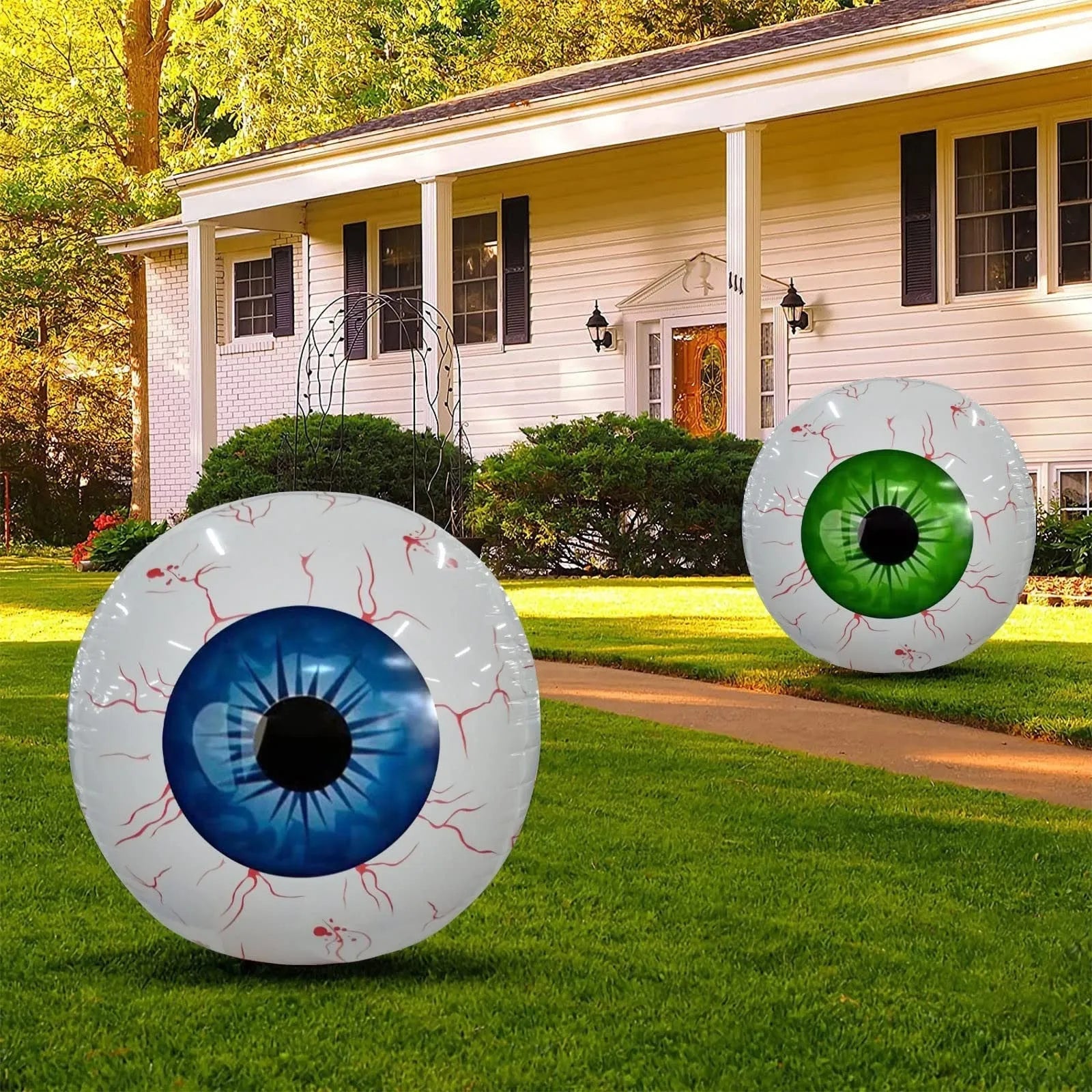 Green Halloween balloon with red bloodshot eyeball design, inflated to a round shape.