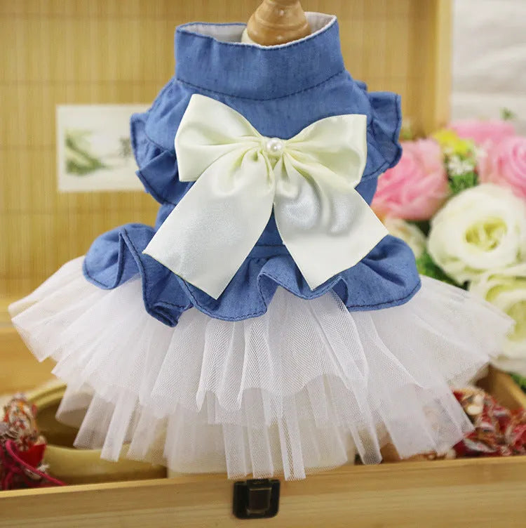 Korean-inspired pink denim pet skirt with a large bow on a dog model.