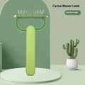 Green and grey dog unknotting combs in small and large sizes on a white background.