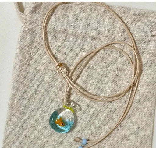 Women's coloured glaze pendant necklace on a beige cotton-linen cord, showing Skirt and Joker design details.