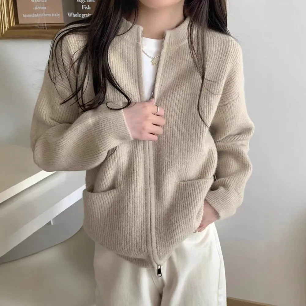 Beige women's long sleeve viscose cardigan sweater coat on a hanger