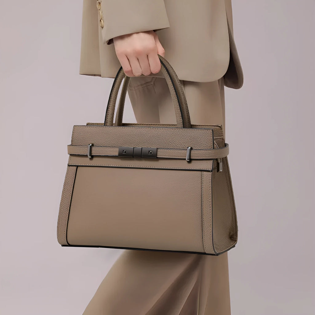 Genuine leather women's crossbody bag in clamshell design with multiple internal pockets
