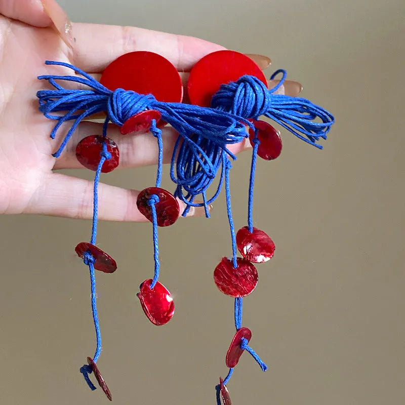 Women's geometric earrings with cloth construction and blue resin flowers