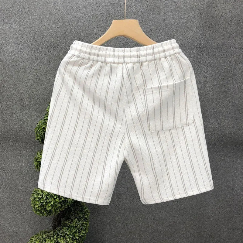 Black and white striped men's casual fleece-lined shorts with an elastic waistband.