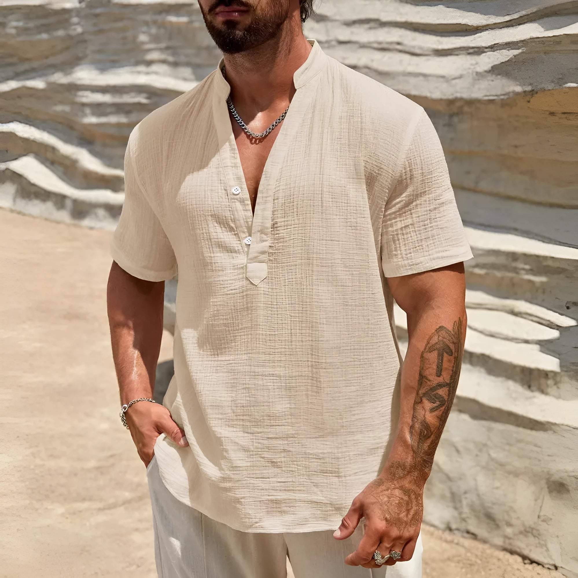 Men's solid colour short-sleeve casual shirt with stand collar on a hanger.