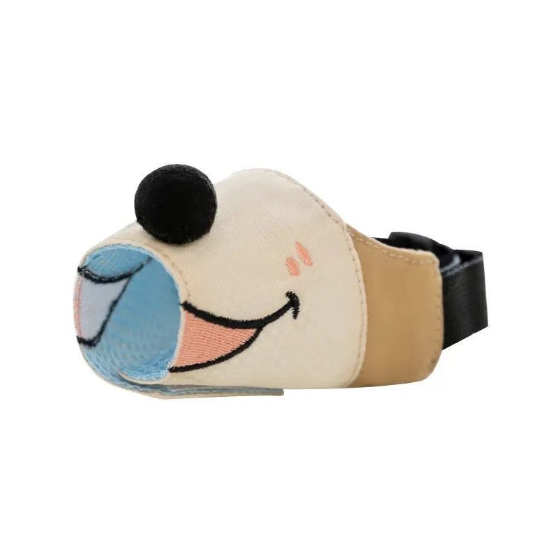 Canvas dog muzzle in Ollie Brown Bear colour with buckle fastening, shown on a dog's snout.