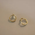 Sterling silver fishtail earrings with gold plating showing 8mm hoop size