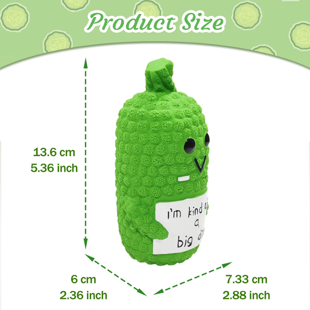 Green pickle-shaped squeaky dog chew toy with textured nubs on natural latex surface.