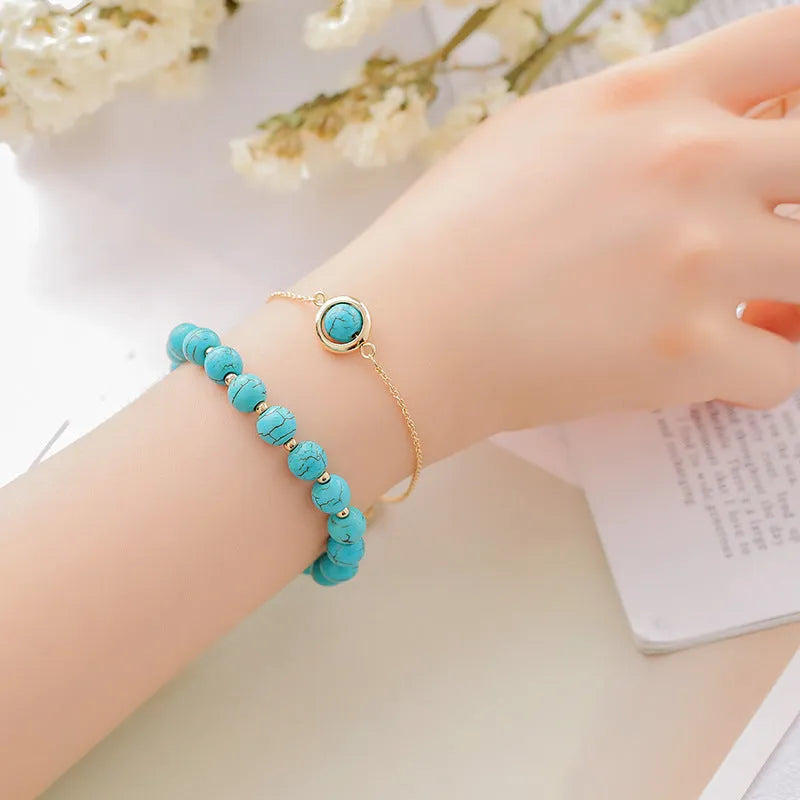 Double-layer women's bracelet with crystal beads and lucky charms in gold electroplated finish