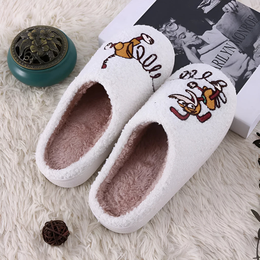 White adult fluffy slippers with cartoon pattern, rubber sole, and plush upper.