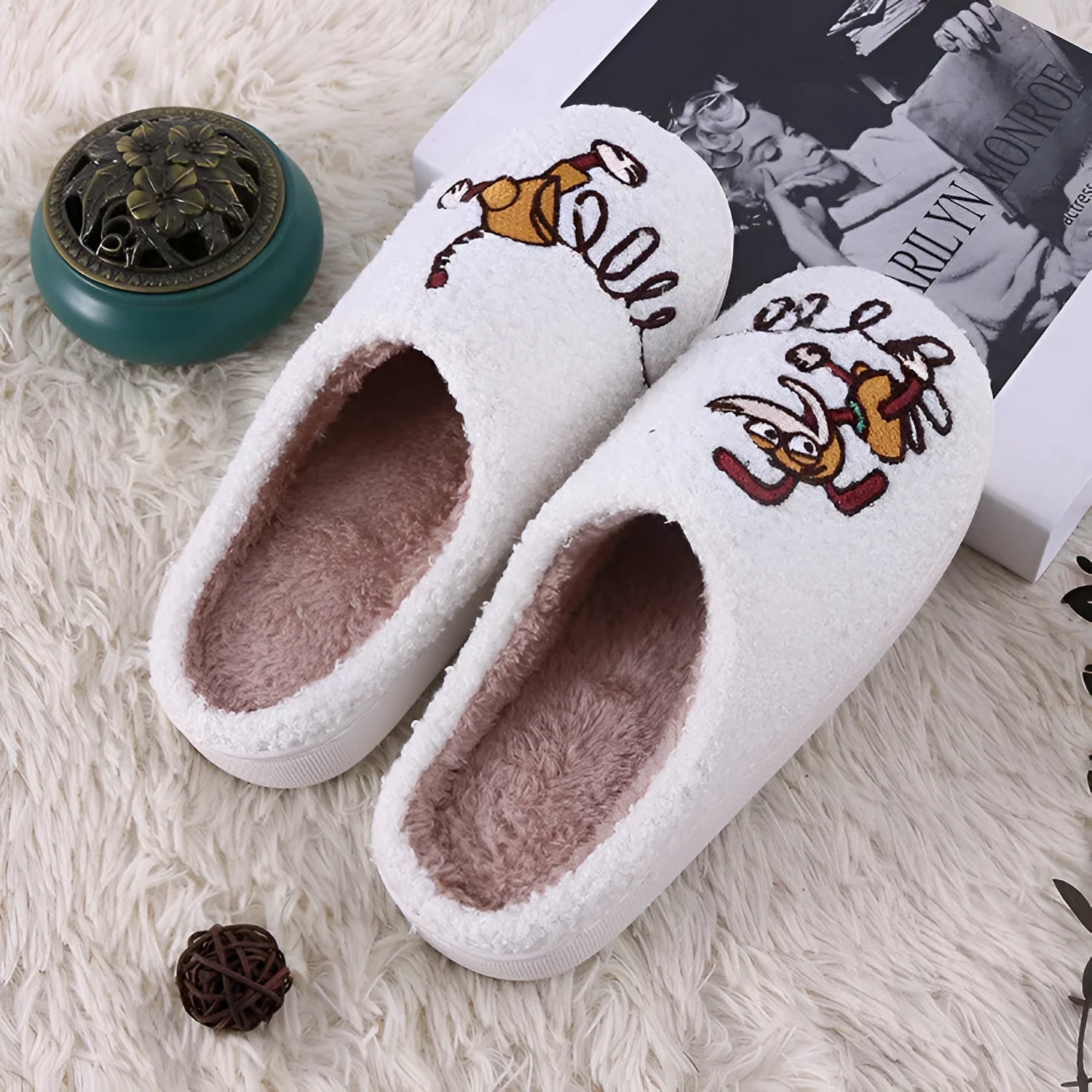 White adult fluffy slippers with cartoon pattern, rubber sole, and plush upper.