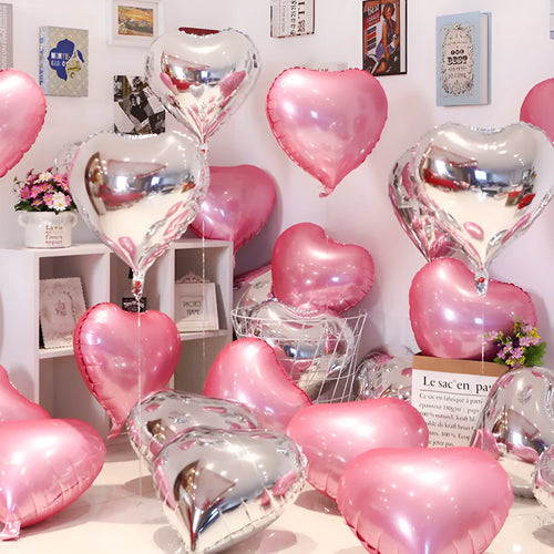 Set of five sparkling peach heart-shaped aluminium foil balloons in assorted colours.