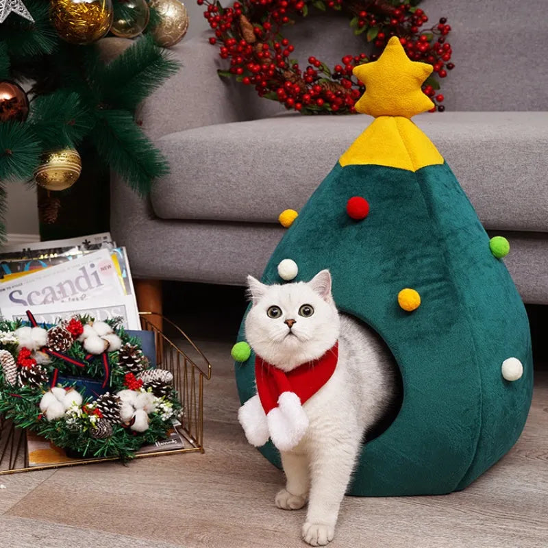 Red Christmas tree shaped cave pet bed with plush interior for a cat or small dog.
