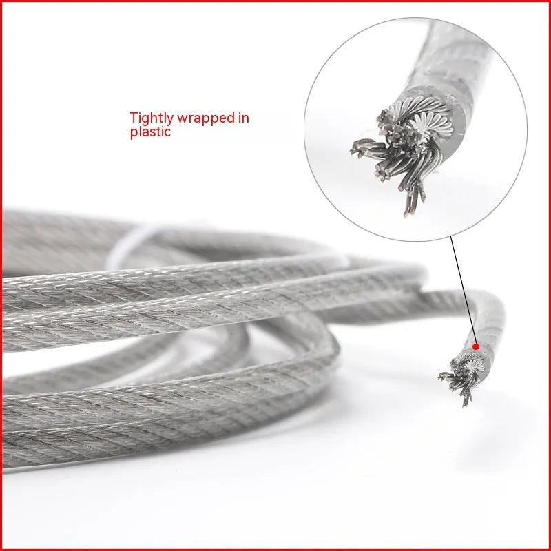 Close-up of a multi-strand 304 stainless steel anti-theft security cable coiled on a dark surface.