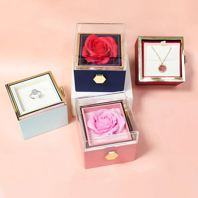 Rotating drawer jewellery gift box with preserved red rose under clear acrylic dome.