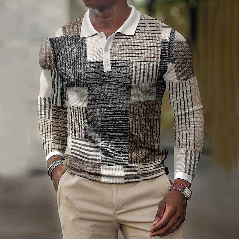 Man wearing a grey 3D printed striped long-sleeved casual top made from polyester fabric.