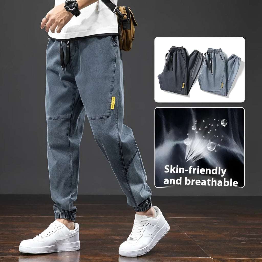 Men's straight leg cargo casual jeans in cotton, showing Korean style and skinny open leg.