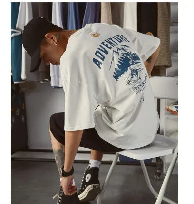 Men's black plus size loose fit short-sleeved t-shirt on a hanger