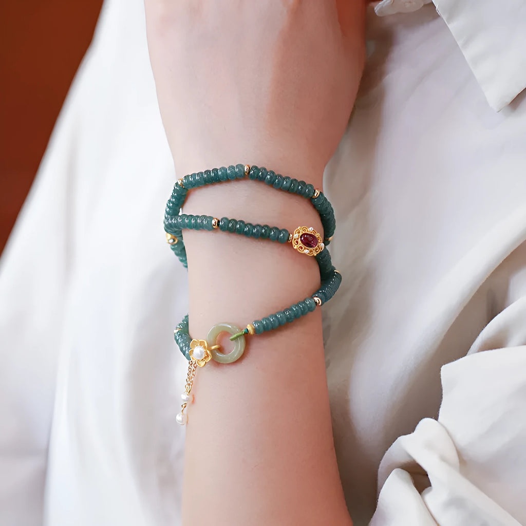 Women's blue water jade abacus beads bracelet with three tourmaline rings and pearl accents