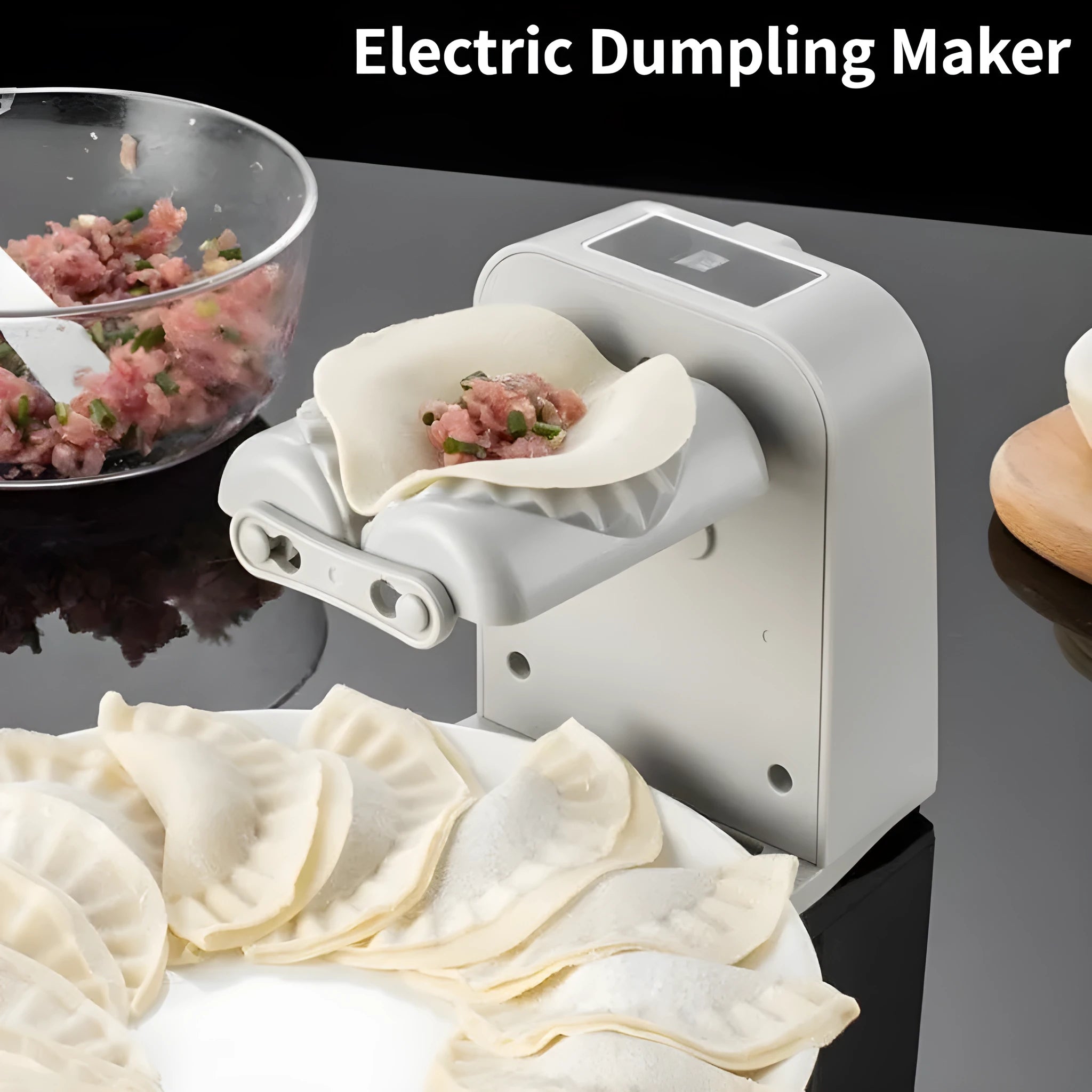 White automatic electric dumpling maker machine with USB charging cable on a kitchen counter