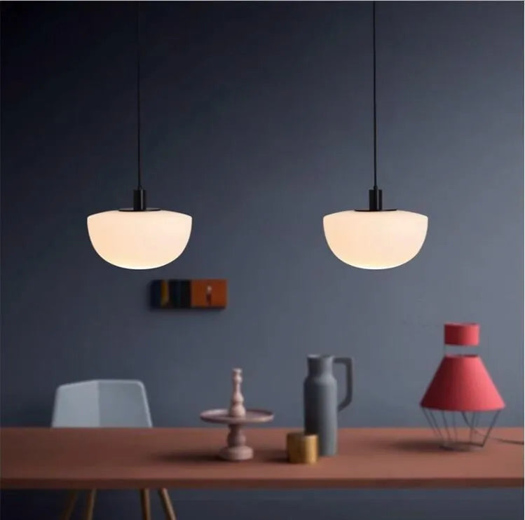 Simple modern glass pendant light with single-head droplight design in milky white finish