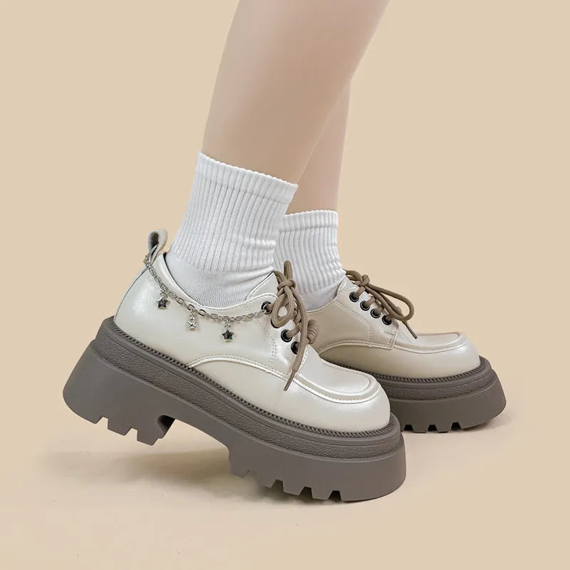 White women's Mary Jane platform shoes with chunky heel and front lace-up.