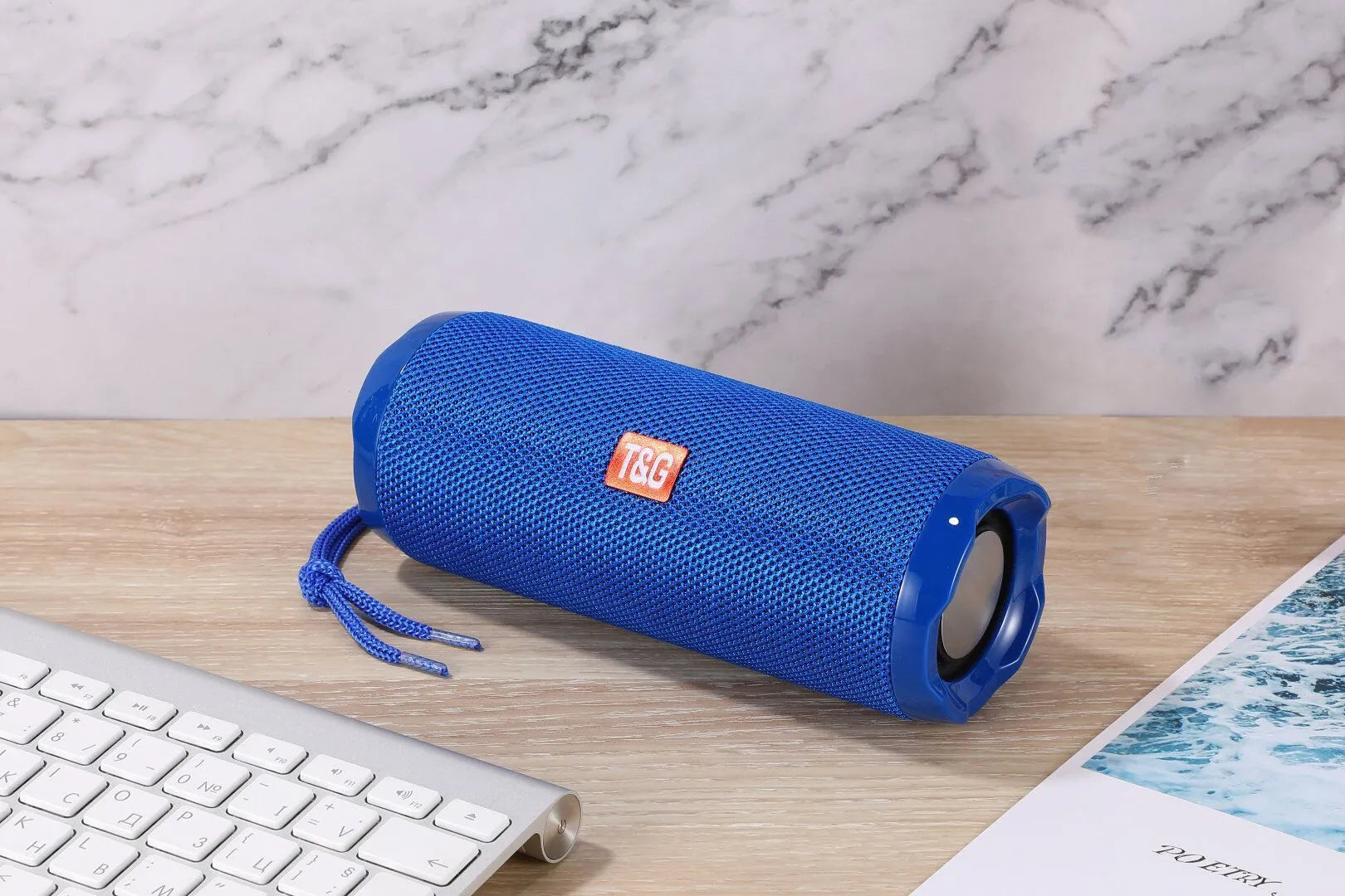 Fabric portable Bluetooth speaker with integrated card slot in multiple colour options.