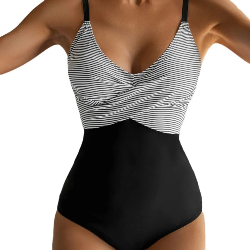 Women's printed lace-up backless one-piece bikini swimsuit on a model, showing floral pattern.