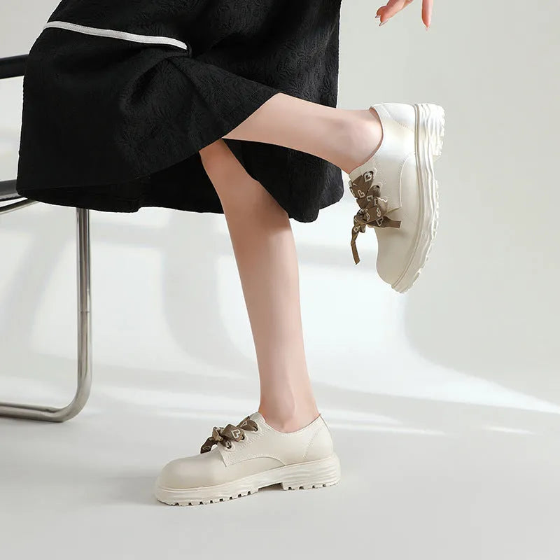 Women's mid-top rain boots with chunky low heel and round toe, available in ivory white, black, or khaki