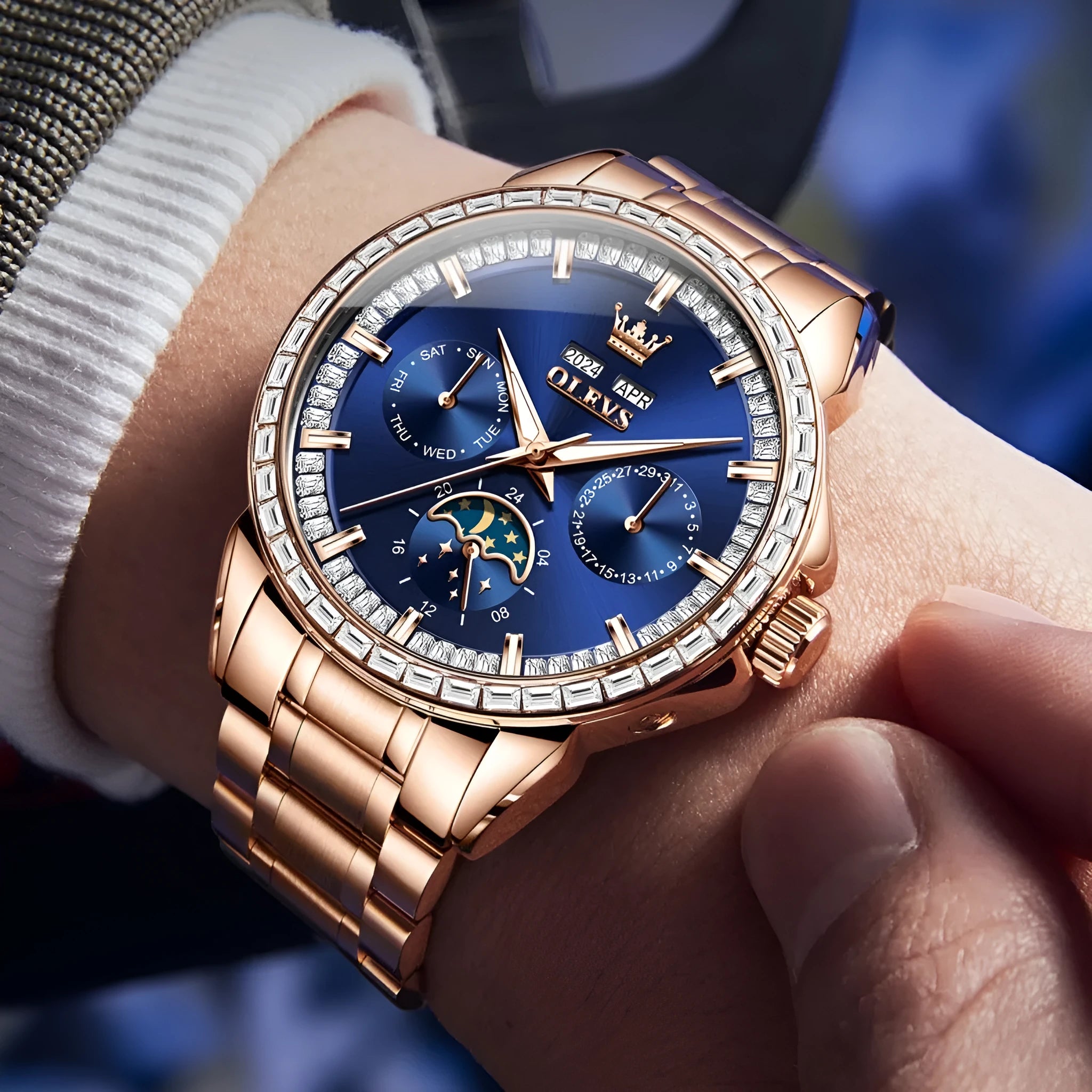 Men's diamond-embedded automatic watch with stainless steel bracelet and transparent case back.