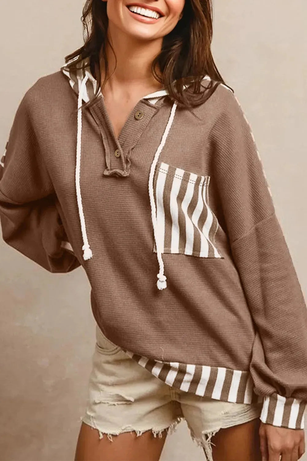 Straw yellow waffle texture striped hoodie with a button neck and drawstring hood.
